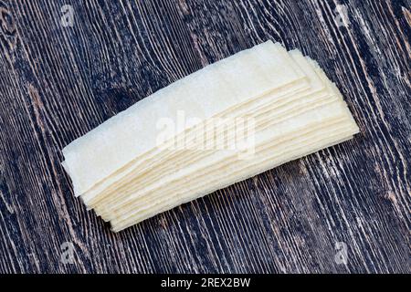 long thin potato chips made from natural grated potatoes with added spices, a large plan of high calorie and unhealthy food Stock Photo