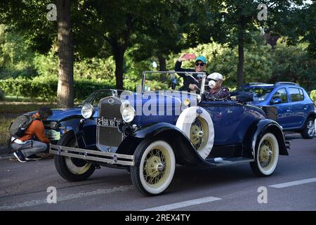 Paris, France. 30th July, 2023. Participants drive with their vehicles during the parade of the 16th “Traversée de Paris” in vintage vehicles in Paris, France, on July 30, 2023. Photo by Firas Abdullah/ABACAPRESS.COM Credit: Abaca Press/Alamy Live News Stock Photo