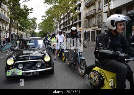 Paris, France. 30th July, 2023. Participants drive with their vehicles during the parade of the 16th “Traversée de Paris” in vintage vehicles in Paris, France, on July 30, 2023. Photo by Firas Abdullah/ABACAPRESS.COM Credit: Abaca Press/Alamy Live News Stock Photo