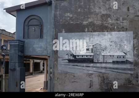 Art on the wall of a house on an old historical street in Thailand, Phang Nga March 2, 2023 Stock Photo