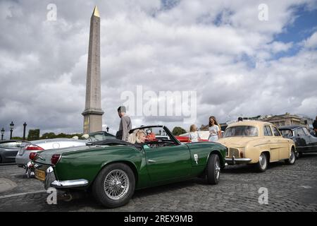 Paris, France. 30th July, 2023. Participants drive with their vehicles during the parade of the 16th “Traversee de Paris” in vintage vehicles in Paris, France, on July 30, 2023. Photo by Firas Abdullah/ABACAPRESS.COM Credit: Abaca Press/Alamy Live News Stock Photo