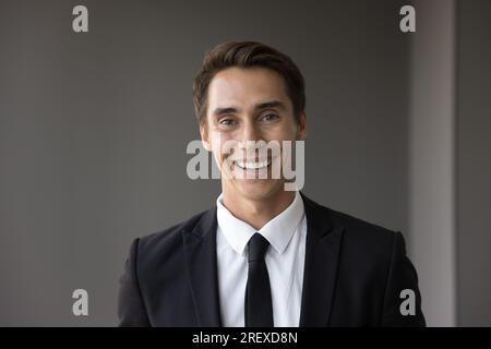 Happy attractive young businessman in formal suit and tie Stock Photo
