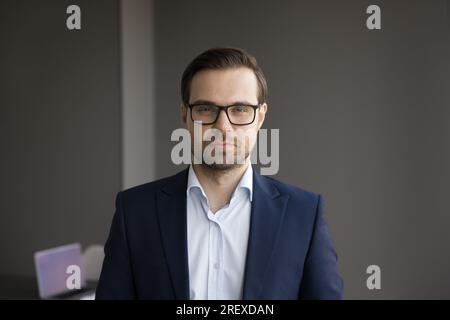 Confident handsome business leader man looking at camera Stock Photo