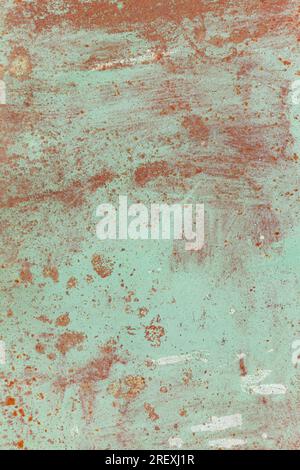Rusty metal surface with old faded paint. Texture of rust and paint. Grunge background Stock Photo