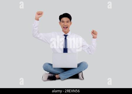 Portrait young asian business man sitting work on laptop computer to internet online isolated white background, businessman confident and notebook, fr Stock Photo