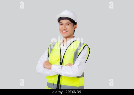 Portrait engineer young asian man wearing helmet standing and smiling with confident isolated on white background, handsome male is architect or contr Stock Photo