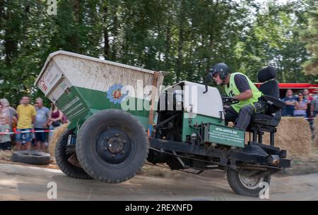 Horka, Germany. 30th July, 2023. A competitor is on the move in his heat of the German Dumper Championship. For many years, a German champion has been crowned on such three-wheeled construction machines who completes the course on the race track in the shortest time. Dumpers were produced in the GDR until 1978, have a 1-cylinder diesel engine of 800 cc, which produces 8.5 hp. Credit: Matthias Rietschel/dpa/Alamy Live News Stock Photo