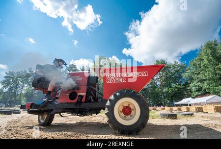 Horka, Germany. 30th July, 2023. A competitor is on the move in his heat of the German Dumper Championship. For many years, a German champion has been crowned on such three-wheeled construction machines who completes the course on the race track in the shortest time. Dumpers were produced in the GDR until 1978, have a 1-cylinder diesel engine of 800 cc, which produces 8.5 hp. Credit: Matthias Rietschel/dpa/Alamy Live News Stock Photo