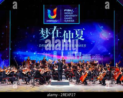 Chengdu, China's Sichuan Province. 30th July, 2023. Musicians play during the concert Dreams of Midsummer at the 31st FISU Summer World University Games Village in Chengdu, southwest China's Sichuan Province, July 30, 2023. Credit: Shen Bohan/Xinhua/Alamy Live News Stock Photo