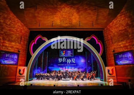 Chengdu, China's Sichuan Province. 30th July, 2023. Musicians play during the concert Dreams of Midsummer at the 31st FISU Summer World University Games Village in Chengdu, southwest China's Sichuan Province, July 30, 2023. Credit: Shen Bohan/Xinhua/Alamy Live News Stock Photo
