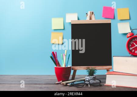 Kids desk creative workspace with school supplies, notebooks. Back to school concept. watercolor pencil need to bring for art class when you back to s Stock Photo