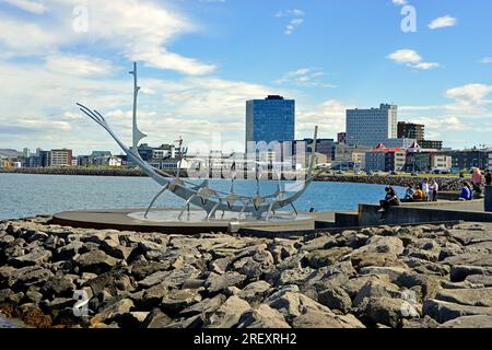 Stainless Steel Sculpture of a Viking Long Ship overlooking the bay in Reykjavik Iceland. The sculpture is known as the Sun Voyager. Stock Photo