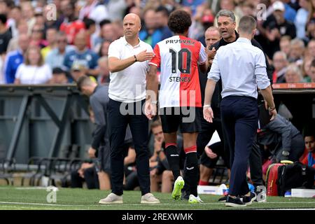 ROTTERDAM - (lr) Feyenoord coach Arne Slot and Calvin Stengs of Feyenoord during the friendly match between Feyenoord and SL Benfica at Feyenoord Stadion de Kuip on July 30, 2023 in Rotterdam, Netherlands. ANP GERRIT VAN KOLOLEN Stock Photo