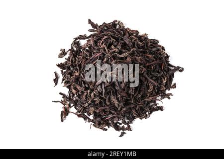 Heap of dried tea leaves isolated on white background. View from above Stock Photo