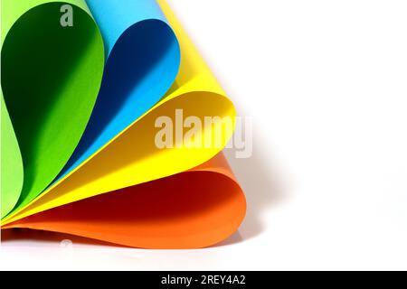 Abstract sheets rolls of multicolor paper on white background with copy space Stock Photo