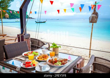 Enjoy a beachside breakfast on your summer vacation. Stock Photo