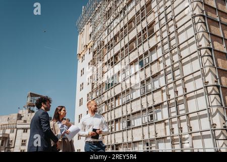 Architecture team planning, doing paperwork, discussing project remotely Stock Photo
