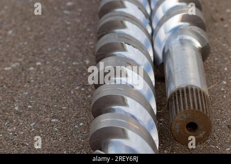 Scrap parts Blending machine screws laying outside . High quality photo Stock Photo