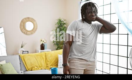 African american man suffering for cervical pain at home Stock Photo