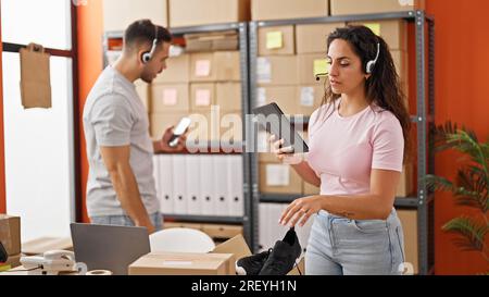 Man and woman ecommerce business workers having video call working at office Stock Photo