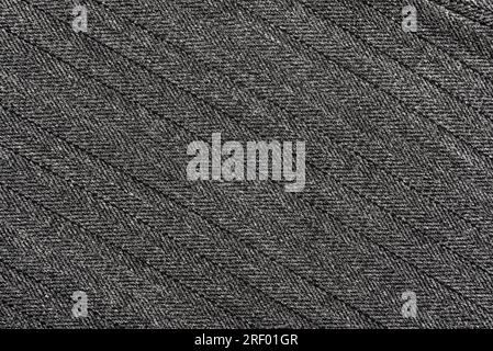 Texture of black fabric with stripes and stitches. Background from dark material for tailoring. Textile Stock Photo