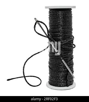 Plastic spool with black synthetic threads close-up. Needle and thread Stock Photo