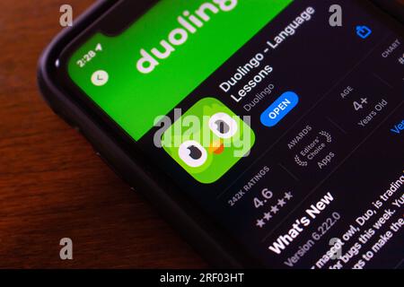 Duolingo app seen in App Store on iPhone. Duolingo is an US educational tech company which produces learning apps and provides language certification Stock Photo
