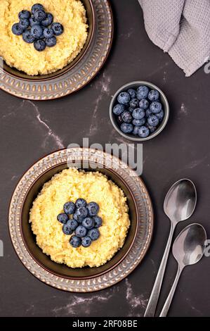 Food photography of millet porridge; blueberry; fibre; ripe; vegan; lifestyle; dish; berry; homemade; ingredient; grain; morning; cereal; Stock Photo