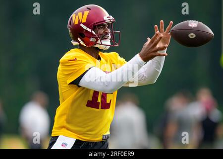 Washington Commanders quarterback Sam Howell (14) warms up prior to the  start of an NFL pre-season football game against the Cleveland Browns,  Friday, Aug. 11, 2023, in Cleveland. (AP Photo/Kirk Irwin Stock