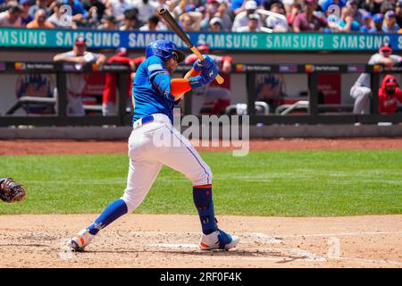 FLUSHING, NY - JULY 30: New York Mets Shortstop Francisco Lindor (12)  throws out Washington Nationals Third Baseman Jeimer Candelario (not  pictured) after fielding a ground ball during the fifth inning of the Major  League Baseball game between the