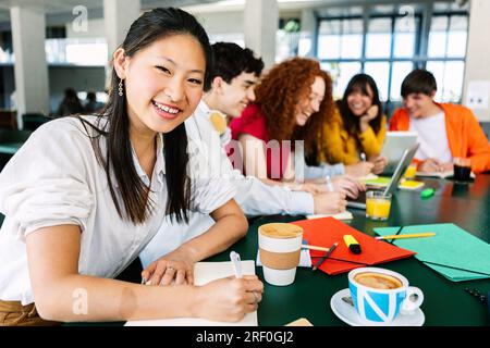 Portrait of asian college student woman smiling at camera Stock Photo