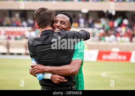 Nairobi, Kenya. 25 Jun 2023.  Johnathan MCKINSTRY (Head Coach, Gor Mahia) and Emery BAYISENGE (DF, Gor Mahia) embrace in celebration after their their 4-1 win. McKINSTRY has managed BAYISENGE in both the Rwanda national team and in Saif Sporting FC in Bangladesh.  Nairobi City Stars v Gor Mahia, Kenyan Premier League.  Gor Mahia won 4-1, becoming Champions of the Kenyan Premier League. Kasarani Stadium. Credit: XtraTimeSports (Darren McKinstry) / Alamy. Stock Photo