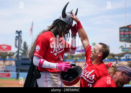 Cincinnati Reds' Spencer Steer (7) places a viking helmet on the head of Elly  De La Cruz (44) after Cruz hit a home run during the second inning of a  baseball game