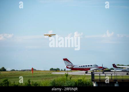 A small plane takes off from Louise M. Thaden Field in Bentonville, Arkansas. Stock Photo