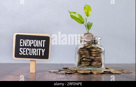 Text ENDPOINT SECURITY on brown paper notepad in businessman hands in office. Stock Photo
