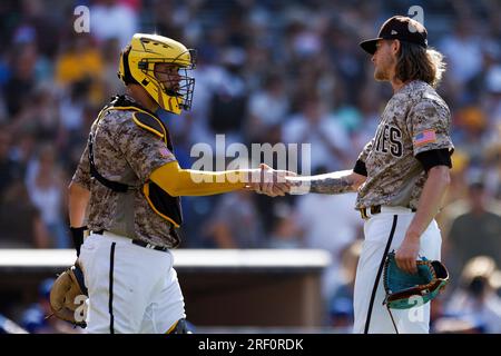 San Diego Padres' Gary Sanchez, left, and Josh Hader shake hands after the  team defeated the Texas Rangers in a baseball game Sunday, July 30, 2023,  in San Diego. (AP Photo/Derrick Tuskan