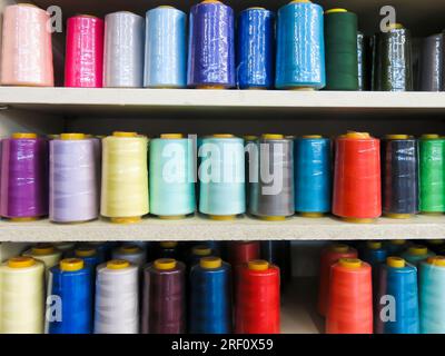 Spools of Sewing Thread on Display in Fabric Center Stock Photo