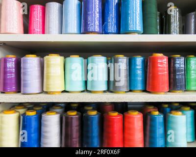 Spools of Sewing Thread on Display in Fabric Center Stock Photo