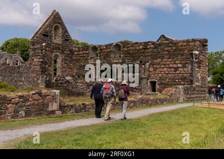 Isle of Iona, Scotland, UK.  6 June 2023. Tourists visiting the Iona Nunnery on of the best preserved medieval nunneries in the UK. Isle of Iona, UK Stock Photo