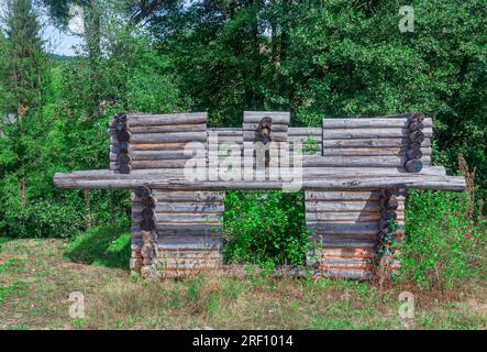 Abandoned log cabin in the forest . Unfinished Wooden Hut Stock Photo