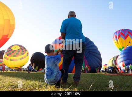Readington, United States. 30th July, 2023. Workers prepare hot air balloons for flight at the New Jersey Lottery Festival of Ballooning at Solberg Airport in Readington, NJ on Sunday, July 30, 2023. Photo by John Angelillo/UPI Credit: UPI/Alamy Live News Stock Photo
