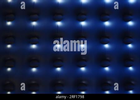 Abstract background in dark blue color with bright glowing dots. Repeating pattern. Stock Photo