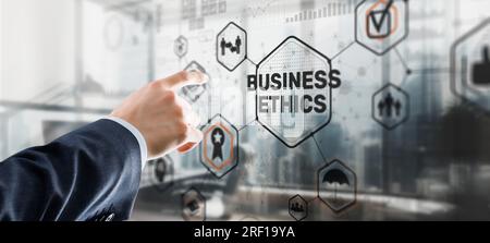 Business man writing business ethic concept on virtual screen. Stock Photo