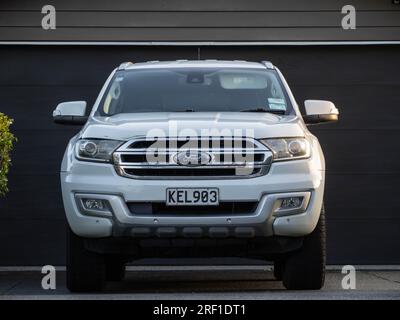 White Ford Ranger pickup truck in front of garage Stock Photo