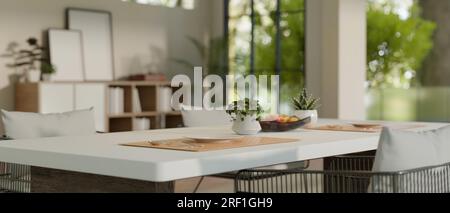 Close-up image of a luxury dining table with beautiful table setting in a modern contemporary home dining room. 3d render, 3d illustration Stock Photo