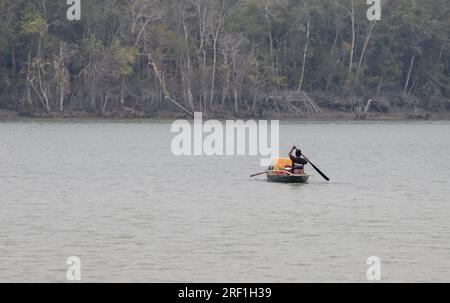 Fishermen in the Sundarbans.this photo was taken from sundarbans national park,Bangladesh. Stock Photo