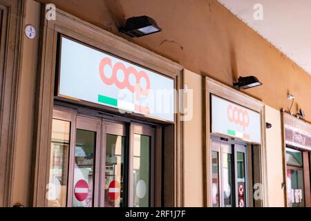 BOLOGNA, ITALY - APRIL 19, 2022: Minimarket Coop storefront and door in Bologna, Italy with Italian flag logo Stock Photo