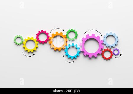 Business processes, teamwork and workflow automation concept. Cogwheels or gears on white background. Stock Photo