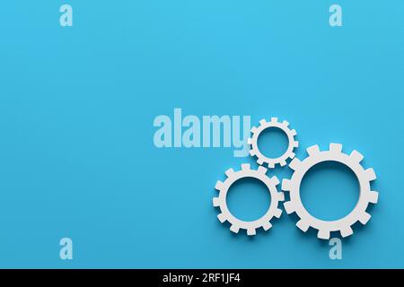 Business processes, teamwork and workflow automation concept. Cogwheels or gears on blue background. Stock Photo