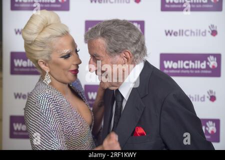 File photo dated 0/06/2015 of Lady Gaga with Tony Bennett before performing at a Well Child Charity concert at the Royal Albert Hall, London. The US singer and actress, 37, broke her silence following the death of her friend and long-time collaborator Tony Bennett, who died in his hometown of New York age 96 on July 21. Sharing an emotional post on Instagram, Gaga wrote: I will miss my friend forever. I will miss singing with him, recording with him, talking with him, being on stage together. Issue date: Monday July 31, 2023. Stock Photo